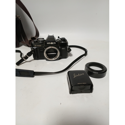 194 - A vintage Minolta X-700 film camera body, with a vintage manual focus zoom lens, specifically a Tou ... 