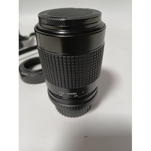 194 - A vintage Minolta X-700 film camera body, with a vintage manual focus zoom lens, specifically a Tou ... 