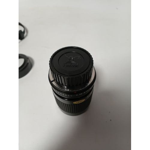 194 - A vintage Minolta X-700 film camera body, with a vintage manual focus zoom lens, specifically a Tou ... 