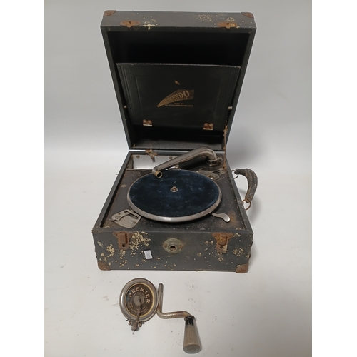 195 - A vintage Decca Crescendo portable wind-up box gramophone. Winds up and spins but needle head needs ... 