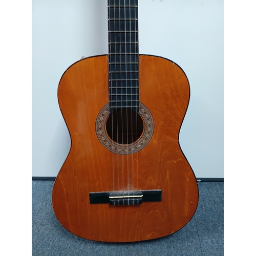 197 - A pair of guitars to include a Zennox electric guitar untested with a stand and an unbranded acousti... 