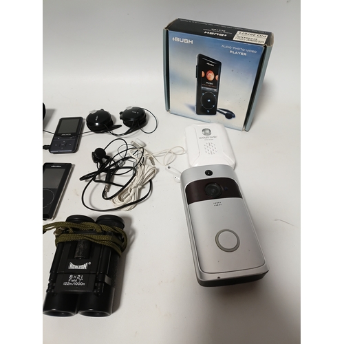 230 - A collection of items to include, door bells, mp3 players, headphones, a Fujifilm camera, 2 camera b... 