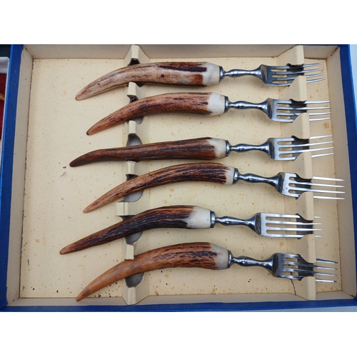 232 - Two sets of boxed antler handled cutlery. To inlcude Alaxander clark knives
