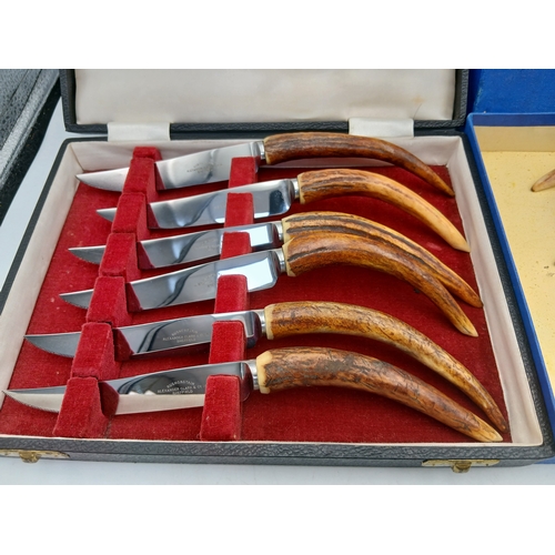 232 - Two sets of boxed antler handled cutlery. To inlcude Alaxander clark knives