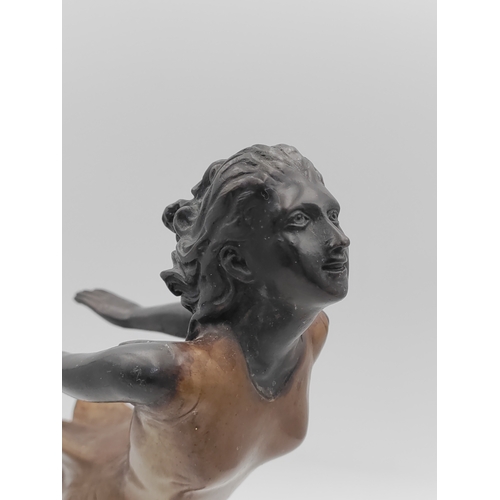 284 - A bronze Art-Deco figurine on an onyx base - Height 28cm
