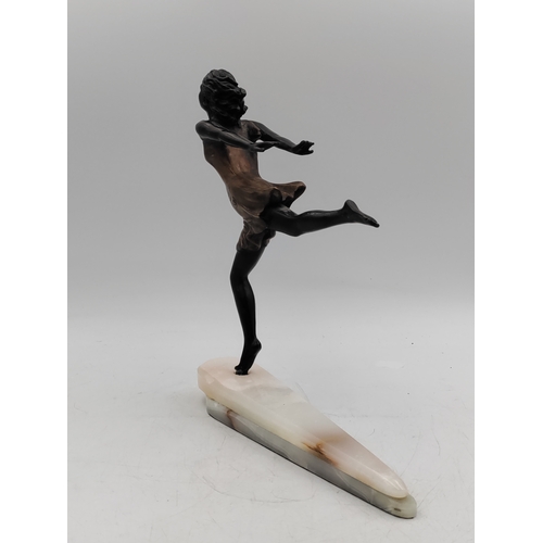 284 - A bronze Art-Deco figurine on an onyx base - Height 28cm