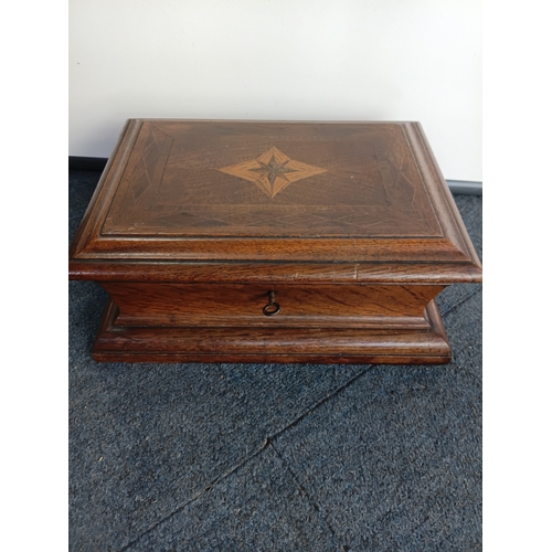 292 - A Victorian inlaid wooden jewellery box with velvet lined removable trays, complete with key. Height... 