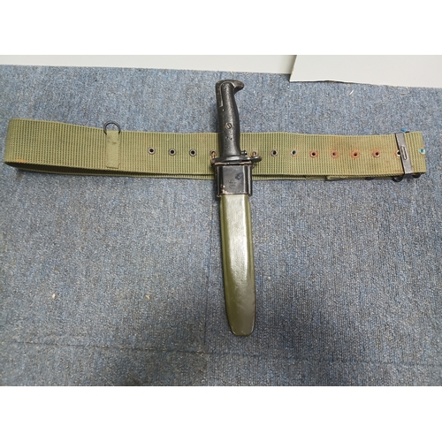 234 - An American 1943 wwii M1 Garand Bayonet with an equipment belt and sheath.