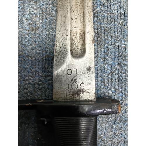 234 - An American 1943 wwii M1 Garand Bayonet with an equipment belt and sheath.
