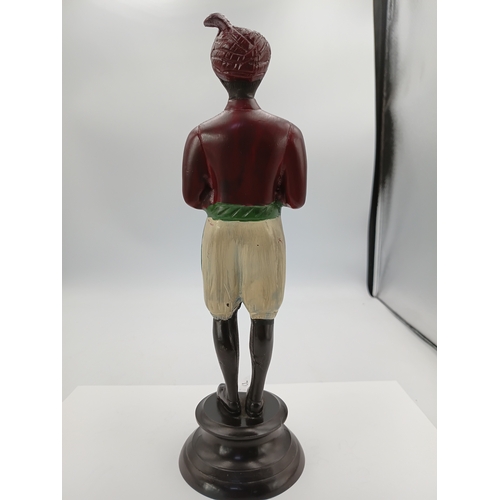 294 - A vintage painted cast metal model depicting a Personal Butler with a tray. Height 10.5 inches