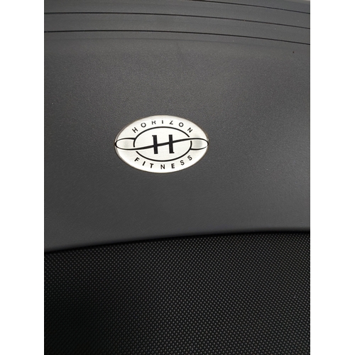 119 - A Horizon fitness treadmill. Folds away. Pat tested and working.
