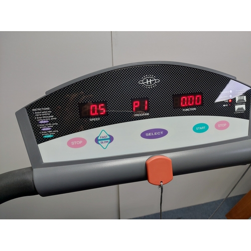 119 - A Horizon fitness treadmill. Folds away. Pat tested and working.