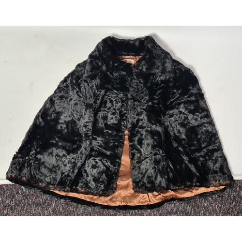 238 - A vintage 1950's John Orton Furrier ladies black fur cape. 53cm drop from button to bottom edge.
