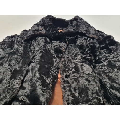 238 - A vintage 1950's John Orton Furrier ladies black fur cape. 53cm drop from button to bottom edge.