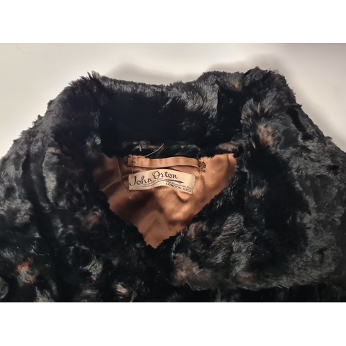 238 - A vintage 1950's John Orton Furrier ladies black fur cape. 53cm drop from button to bottom edge.