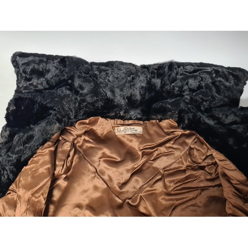 238 - A vintage 1950's John Orton Furrier ladies black fur cape. 53cm drop from button to bottom edge.