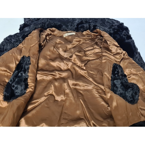 238 - A vintage 1950's John Orton Furrier ladies black fur cape. 53cm drop from button to bottom edge.