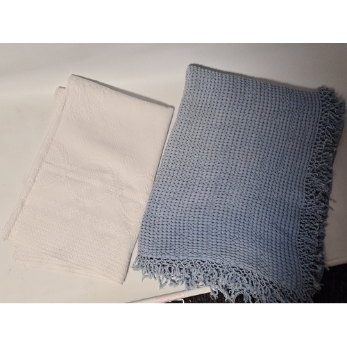 239 - 2 vintage mid century blankets to include a blue one with tassels measuring 190cm x125cm and a white... 