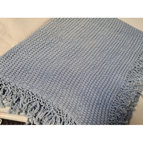 239 - 2 vintage mid century blankets to include a blue one with tassels measuring 190cm x125cm and a white... 