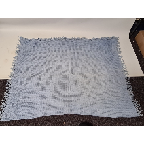 239 - 2 vintage mid century blankets to include a blue one with tassels measuring 190cm x125cm and a white... 