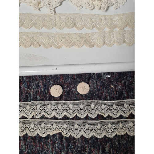241 - A collection of vintage lace items to include a netted dress (in parts), a white tablecloth which me... 