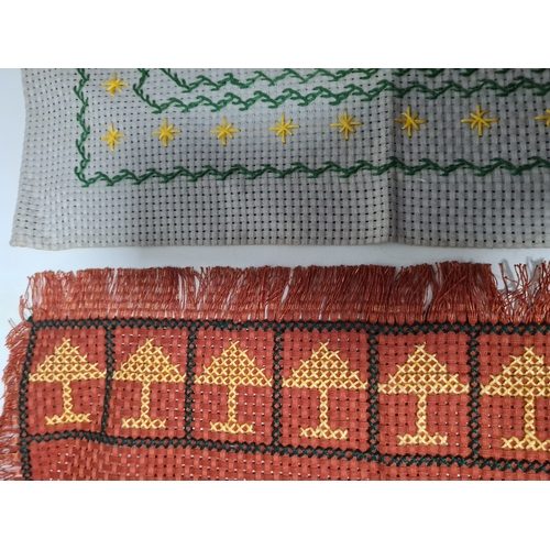 243 - A collection of late 19th to early to 20th century fabric samplers and cross stitch fabrics.