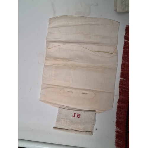 243 - A collection of late 19th to early to 20th century fabric samplers and cross stitch fabrics.