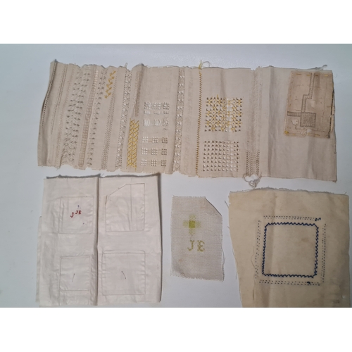 243 - A collection of late 19th to early to 20th century fabric samplers and cross stitch fabrics.