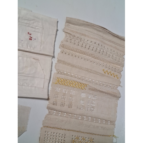 243 - A collection of late 19th to early to 20th century fabric samplers and cross stitch fabrics.