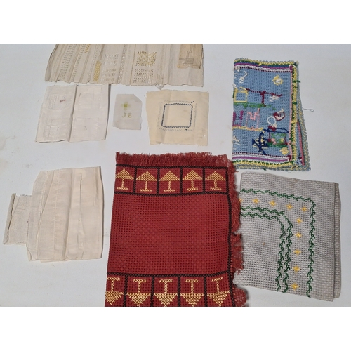 243 - A collection of late 19th to early to 20th century fabric samplers and cross stitch fabrics.