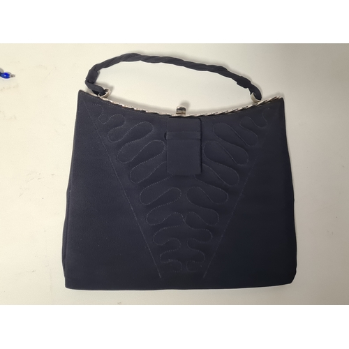 244 - A collection of 4 Ladies mid 20th century handbags to include a blue embroidered and beaded bag, a b... 