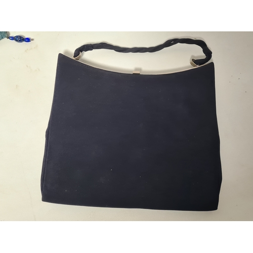244 - A collection of 4 Ladies mid 20th century handbags to include a blue embroidered and beaded bag, a b... 