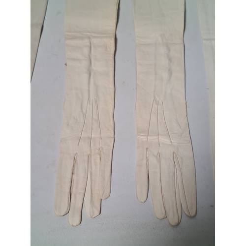 248 - A collection of 6 Victorian or Edwardian Ladies long white Gloves to include 2 pairs. 4 gloves made ... 