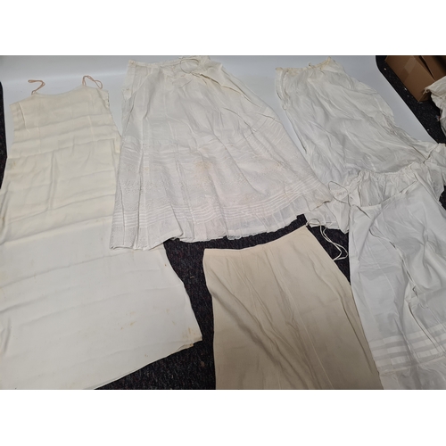 298 - A collection of 5 Victorian & Edwardian white underskirts & slips. Some have lace detailing