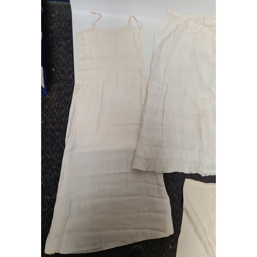 298 - A collection of 5 Victorian & Edwardian white underskirts & slips. Some have lace detailing