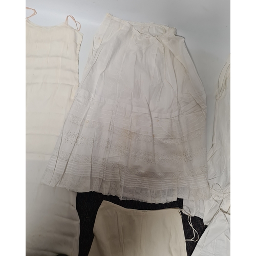 298 - A collection of 5 Victorian & Edwardian white underskirts & slips. Some have lace detailing