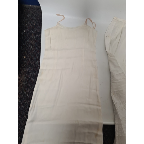 298 - A collection of 5 Victorian & Edwardian white underskirts & slips. Some have lace detailing