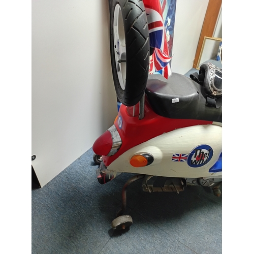 235 - A MOD scooter model ideal for a mancave with 2 scooter large wall art items.