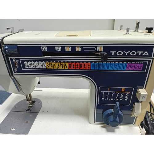 13 - A vintage Toyota 707 sewing machine. Pat tested. working.