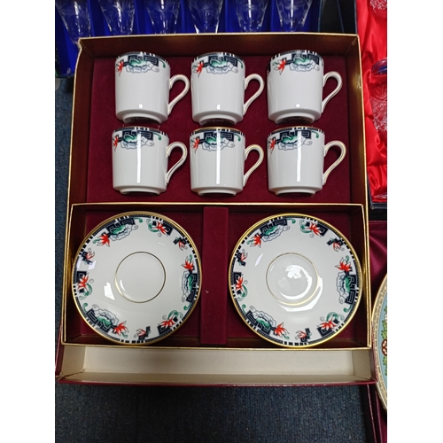 15 - A collection of ceramic items, including tea sets, decorative plates with emblems and sets of crysta... 