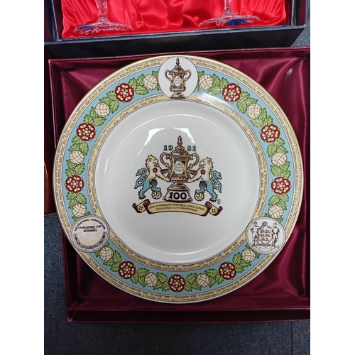 15 - A collection of ceramic items, including tea sets, decorative plates with emblems and sets of crysta... 