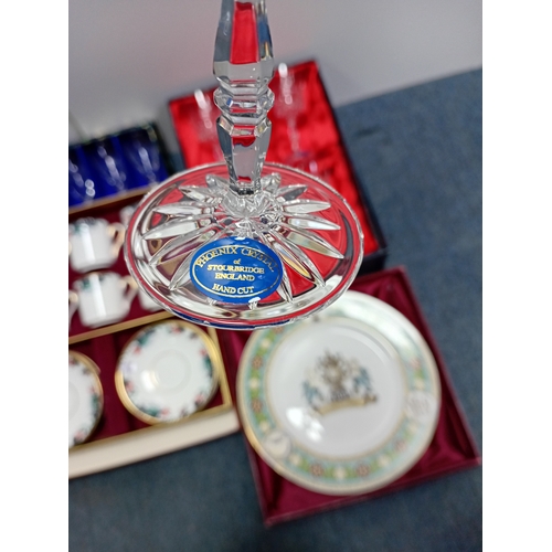15 - A collection of ceramic items, including tea sets, decorative plates with emblems and sets of crysta... 