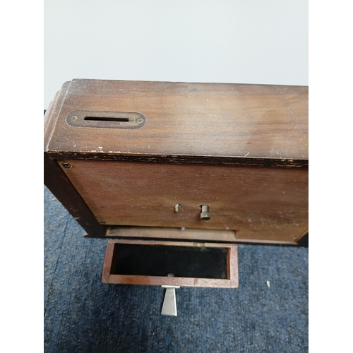 23 - A pair of mantle clocks to include, a rare vintage mid-century money box savings mantel clock and a ... 