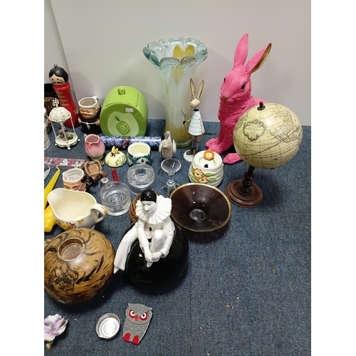 37 - A job lot of ceramic items to include, vases, cups figurines, spoons and more. The largest item meas... 