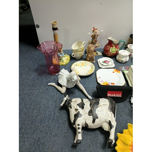37 - A job lot of ceramic items to include, vases, cups figurines, spoons and more. The largest item meas... 