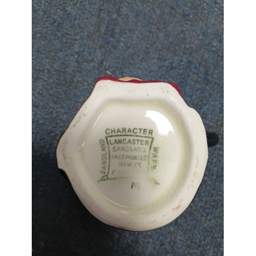 37 - A job lot of ceramic items to include, vases, cups figurines, spoons and more. The largest item meas... 