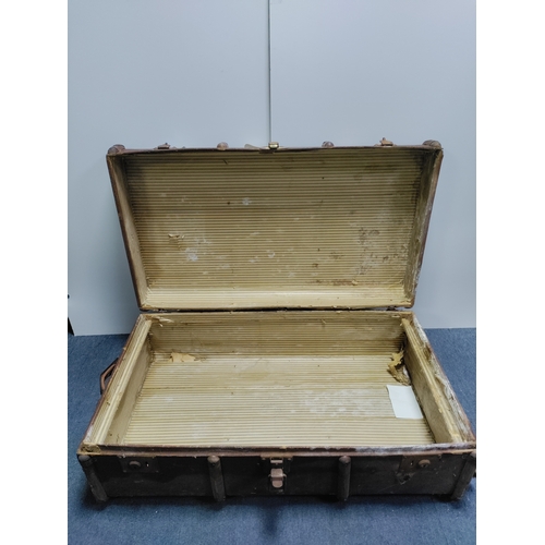 302 - A collectable vintage steamer trunk featuring various travel stickers from destinations like Rome an... 