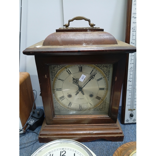 203 - A collection of clocks, barometers and a thermometer to include  a Tristar mantle clock, a quartz cl... 