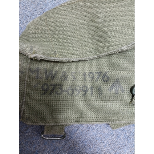 204 - A collection of 4 British army items which display the broadarrow. To include, a canvas heavy duty b... 