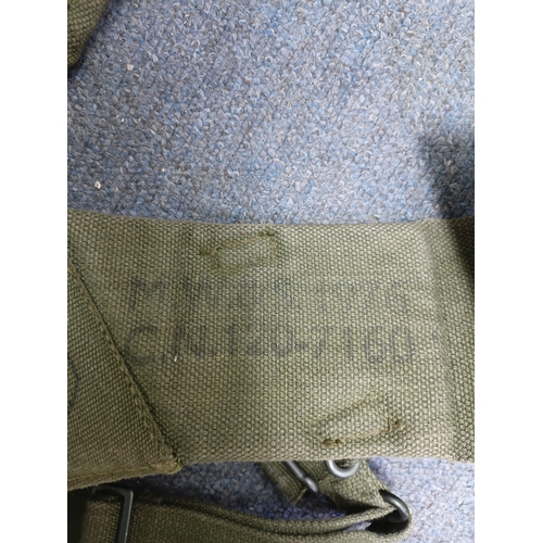 204 - A collection of 4 British army items which display the broadarrow. To include, a canvas heavy duty b... 